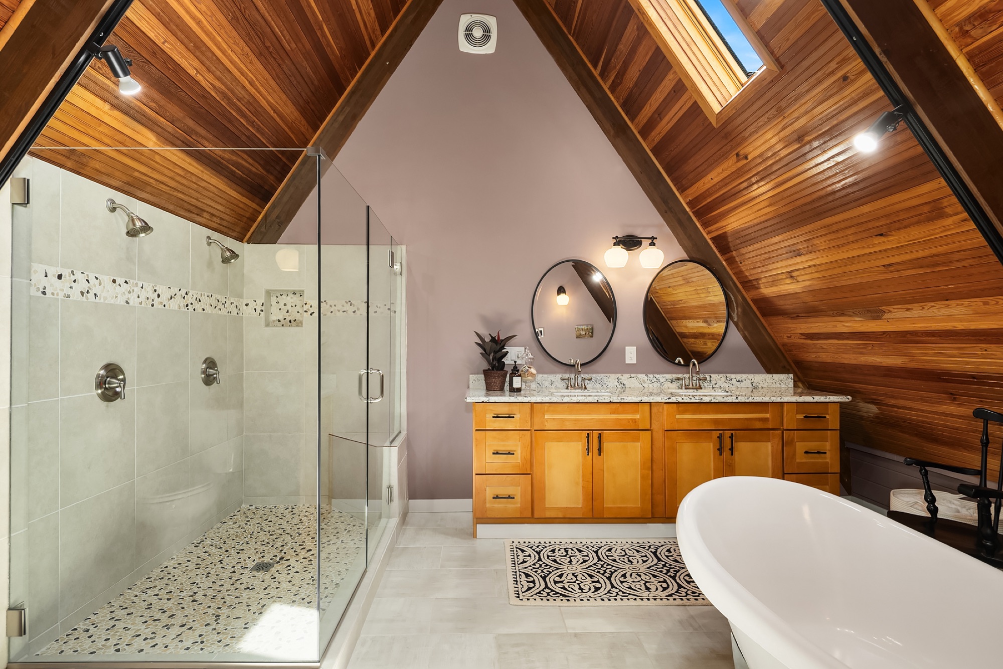Primary ensuite with glass shower and soaking tub